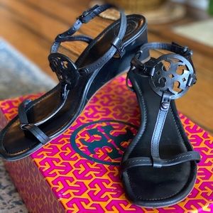 Tory Burch black leather platform heels.